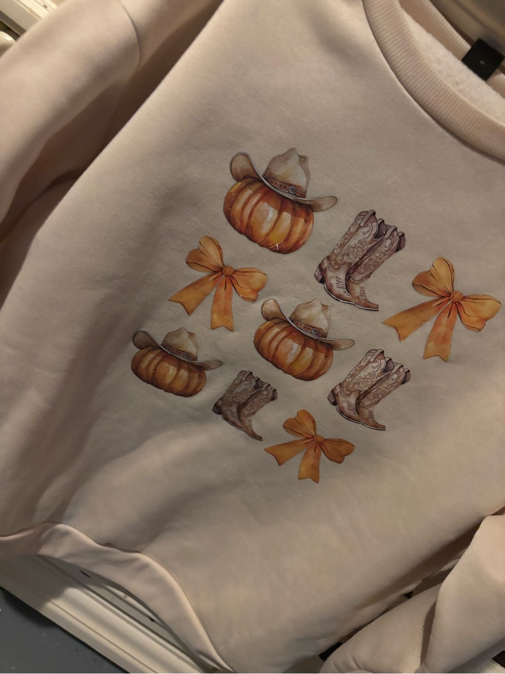 Cream Women’s Pullover Sweatshirt with Pumpkin & Boot Graphic